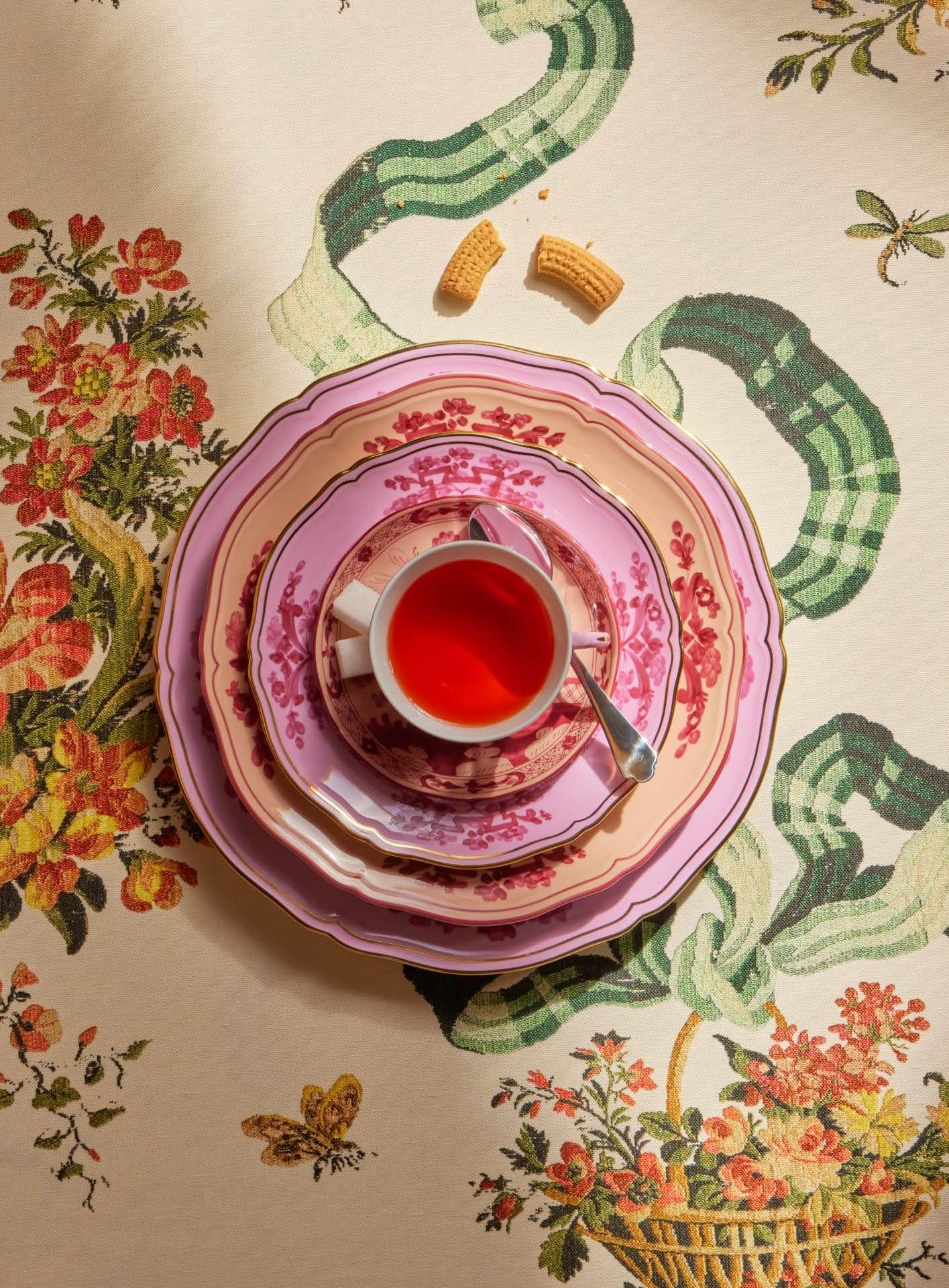 Elegant white cake decorated with purple iris flowers on a white cake stand